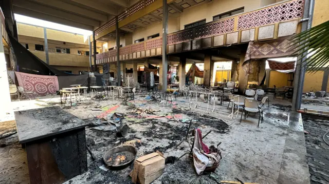 Damaged chairs stand amid debris at Shadia Abu Ghazaleh school following an Israeli raid, amid the ongoing conflict between Israel and Palestinian Islamist group Hamas, in Jabalia in the northern Gaza Strip, December 15, 2023.