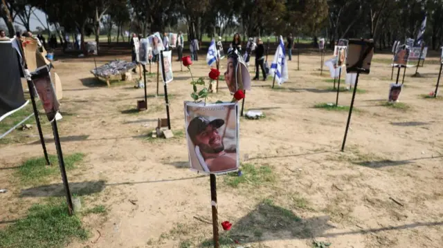 Flowers are left at an installation at the site of the Nova festival, where party goers were raped, killed and kidnapped during the October 7 attack by Hamas, in Reim, southern Israel