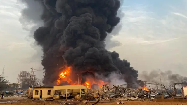 Fire burns after a blast at an oil terminal in Conakry, Guinea December 18, 2023