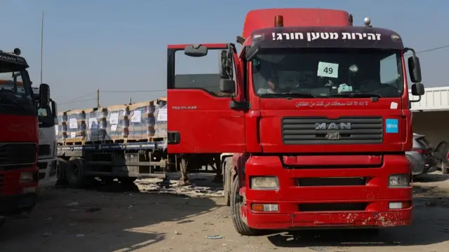 A man sits in a truck carrying aid at the Rafah border, amid the ongoing conflict between Israel and the Palestinian Islamist group Hamas, in Rafah in the southern Gaza Strip, December 18, 2023