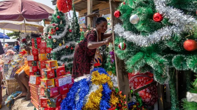 Buyers browse for Christmas decorations in Ibadan, Nigeria, 18 December 2023.