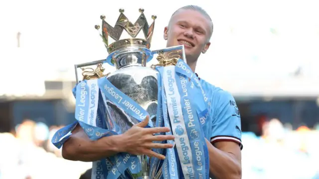 Erling Haaland celebrates winning the Premier League