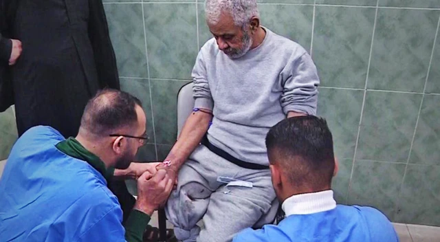 Medics treating Mahmoud Abu Husein at a hospital in Rafah