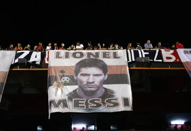 Newell's Old Boys fans with Lionel Messi banner.