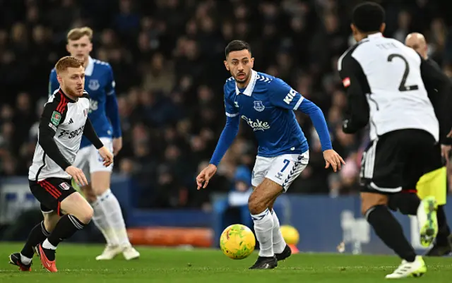 Dwight McNeil (C) vies with Fulham's Dutch defender Kenny Tete