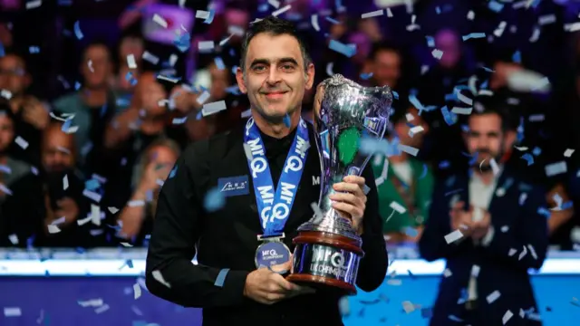 Ronnie O'Sullivan celebrates winning the UK Championship