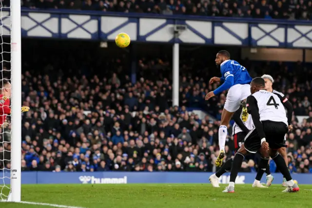 Everton's Beto heads the ball