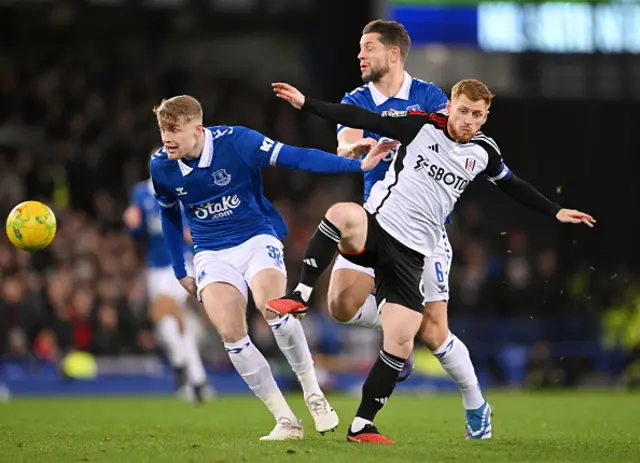 Jarrad Branthwaite of Everton is challenged by Harrison Reed