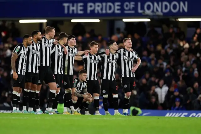 Newcastle United's players react during the penalty shoot out