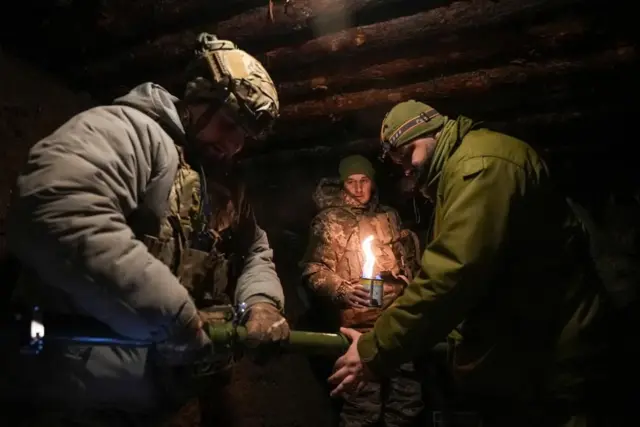 Ukrainian troops prepare a combat drone near the frontline city of Bakhmut, in eastern Ukraine