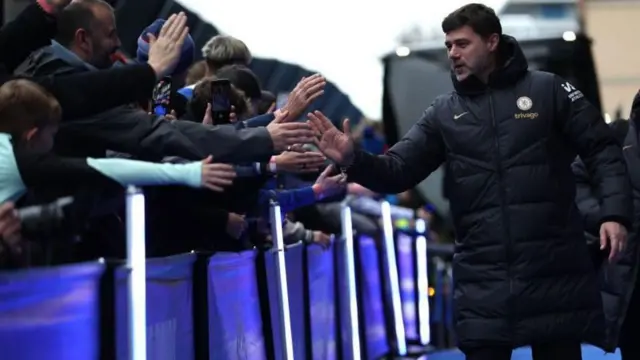 Mauricio Pochettino greets Chelsea fans