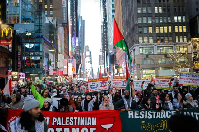 New Yorkers participating in a protests as part of a global strike on Monday