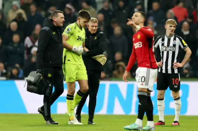 Nick Pope walking off injured