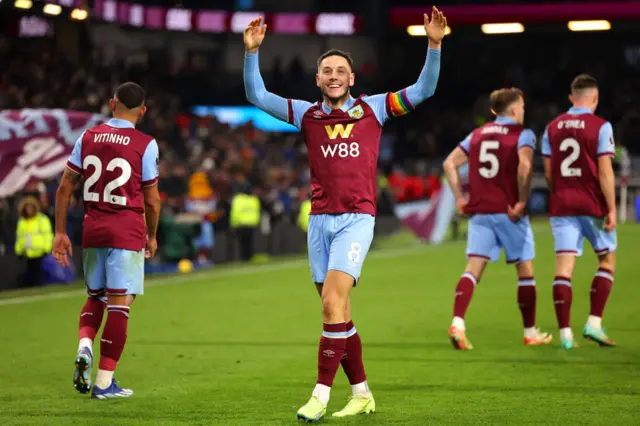 Brownhill takes the acclaim of the fans after adding the fifth Burnley goal.