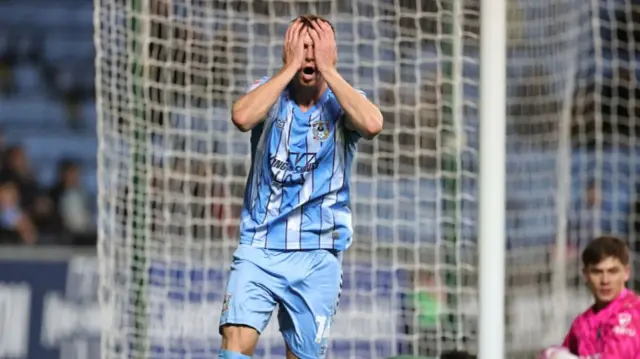 Coventry's Ben Sheaf covers his eyes