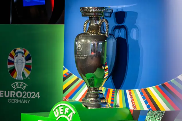 A giant Euros trophy replica stands outside the hall of the finals draw.