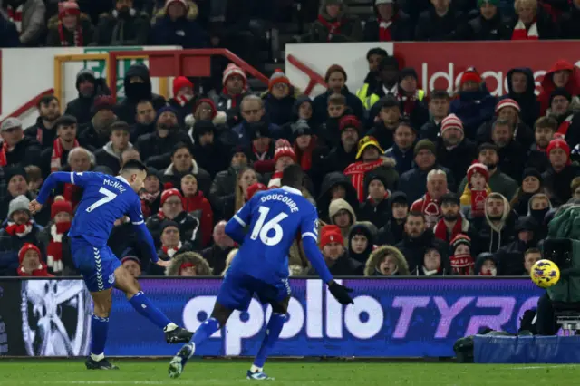 McNeil fires a shot towards goal to open the scoring for Everton.