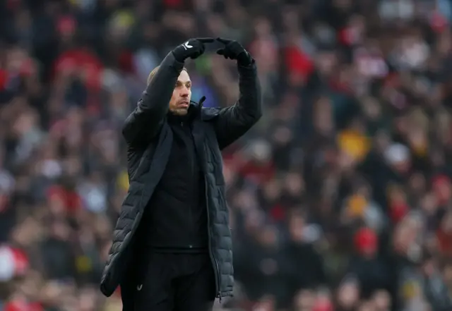 O'Neil gestures instructions to his players.