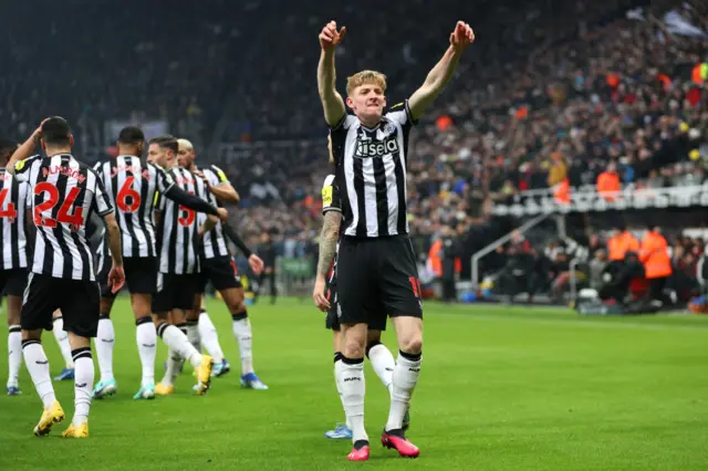 Gordon takes in the applause of the fans after opening the scoring.