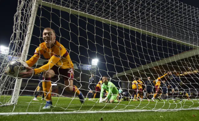 Conor Wilkinson celebrates his late, late equaliser