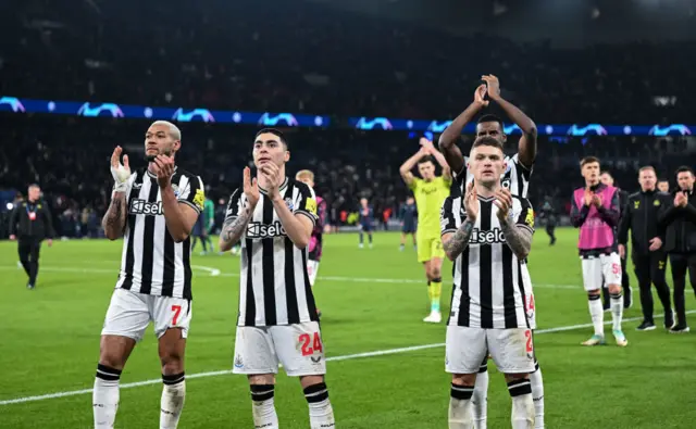 Newcastle players clap the travelling fans in Paris.