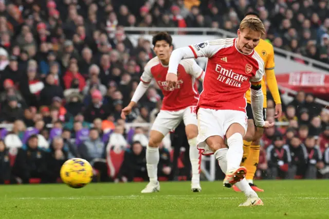 Odegaard sweeps the ball home from the edge of the box.