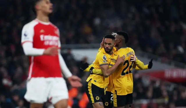 Cunha and Semedo embrace as Gabriel shouts into the air.