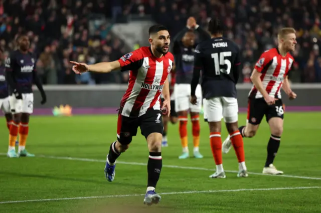 Maupay wheels away to celebrate opening the scoring.