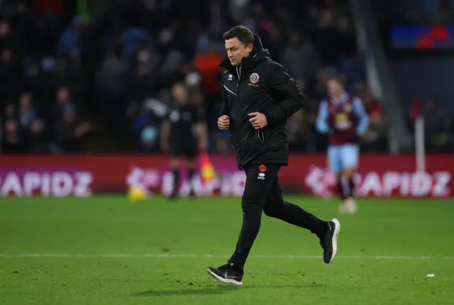 Heckingbottom runs across the pitch towards the dugout.