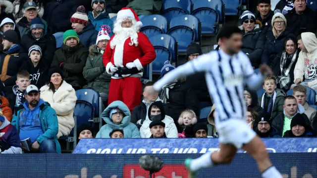 Santa watches from the stands