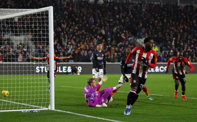 Baptists runs to celebrate as his goal leaves Luton's defence on the floor.