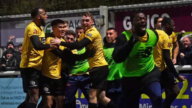 Maidstone celebrate their winner against Barrow