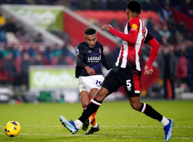 Brown fires home to pull a goal back for Luton.