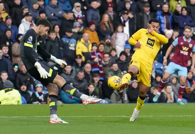 Trafford clears the ball as he is closed down by Cameron Archer.