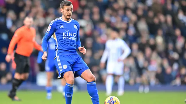 Harry Winks passes the ball