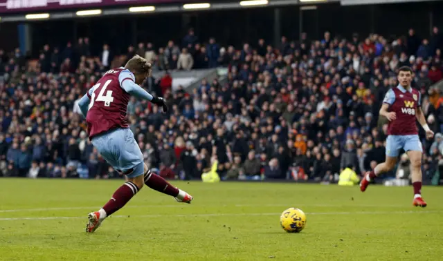 Larsen slots home the ball for Burnley's second goal.