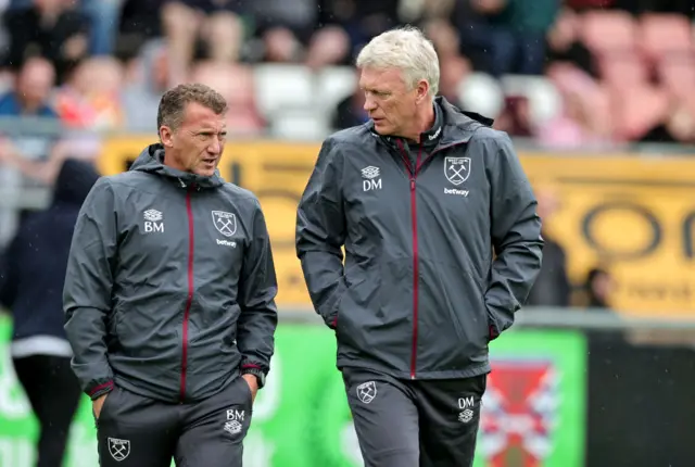 David Moyes, right, the West Ham United manager, talks with first team coach, Billy McKinlay