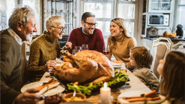 Family around the table for a festive dinner