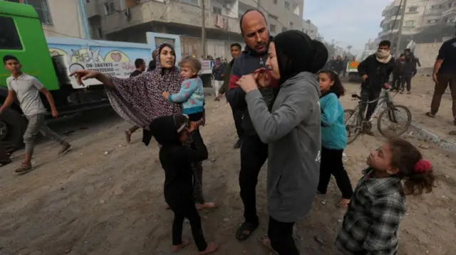 A Palestinian family following an Israeli air strike in Rafah