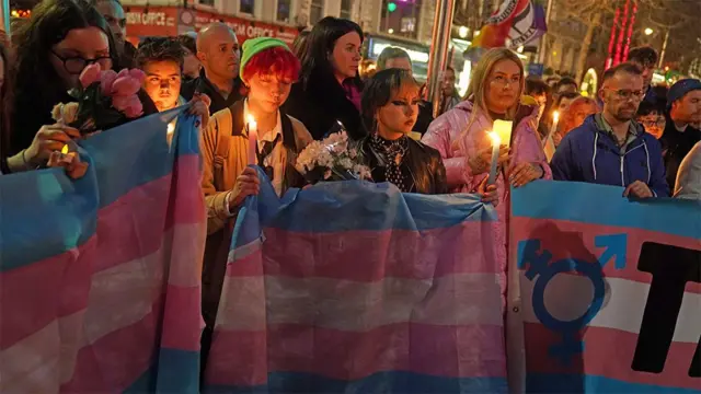 People holding banners at vigils in memory of Brianna