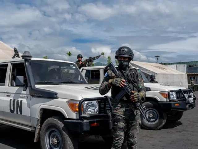 A peacekeeper of the United Nations Organization Stabilization Mission in the Democratic Republic of the Congo (MONUSCO) looks on at the force's base during a field training exercise in Sake, eastern Democratic Republic of Congo, November 06, 2023