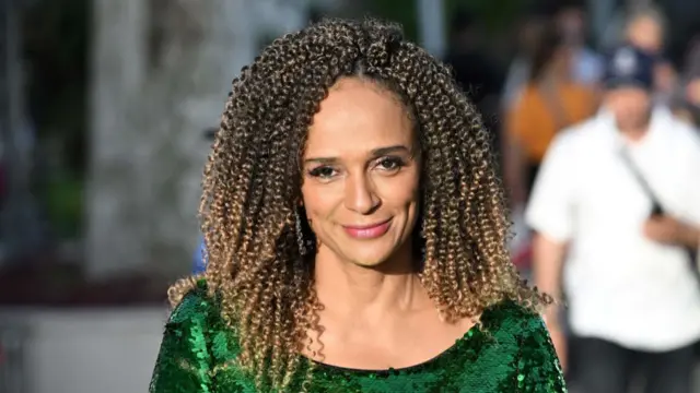 Angolan businesswoman Isabel Dos Santos smiles as she leaves the screening of the film "Mother And Son (Un Petit Frere)" during the 75th edition of the Cannes Film Festival in Cannes, southern France.