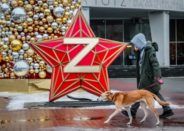 The Z symbol is less common in Moscow but still seen in the city - including alongside this Christmas tree