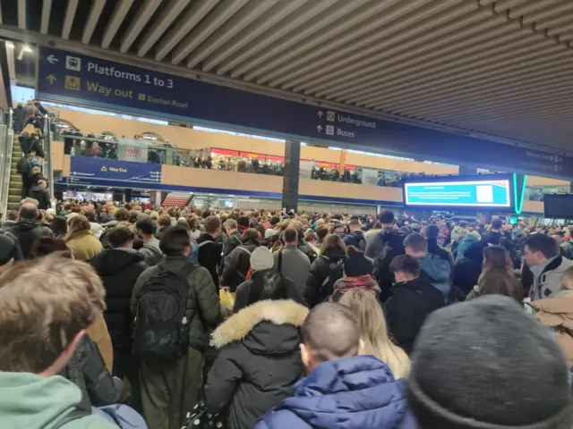 A crowd of people at Euston station