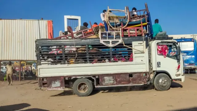 Displaced people fleeing from Wad Madani in Sudan's Jazira state arrive in Gedaref in the country's east on December 19, 2023.