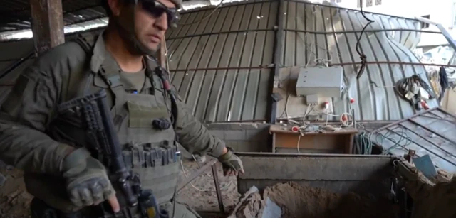 Lt Ido, 401st Brigade, IDF, points to a claimed tunnel entrance