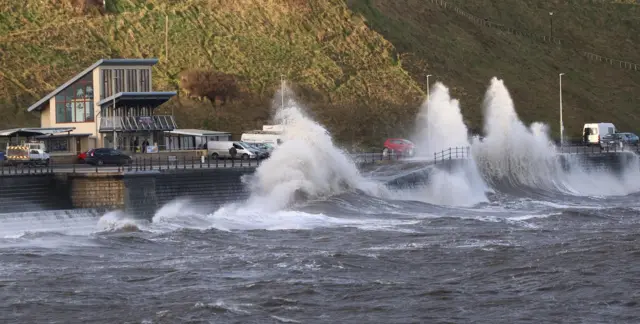 Waves crashing into the sea wall