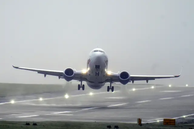 An aircraft takes off from a runway