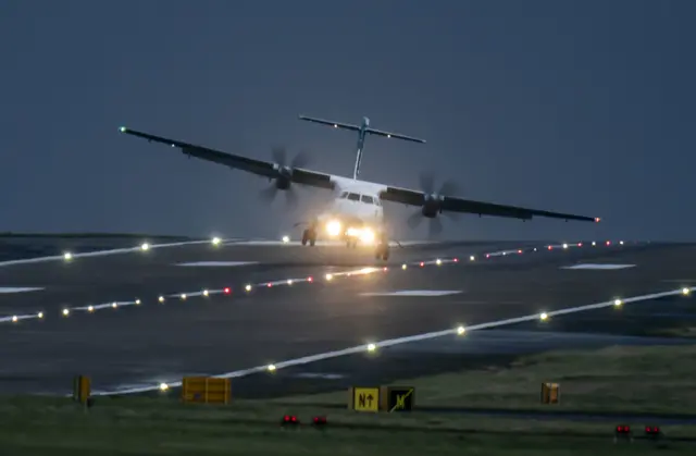 Plane tilts as it lands at Leeds Braford Airport