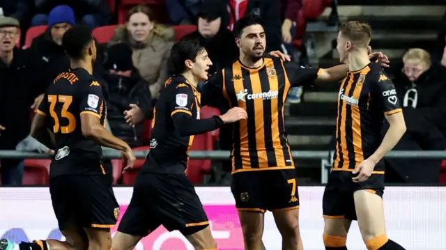 Ozan Tufan celebrates giving Hull the lead at Bristol City